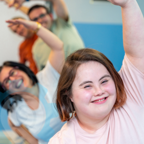 Person with disability participating in a supported exercise activity — representing autonomy, wellbeing, and person-centred service delivery.