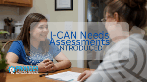 NDIS participant and support worker seated at a kitchen table, engaged in a friendly conversation during a home-based I-CAN Needs Assessment the the text "I-CAN Neeeds Assessments Introduced"